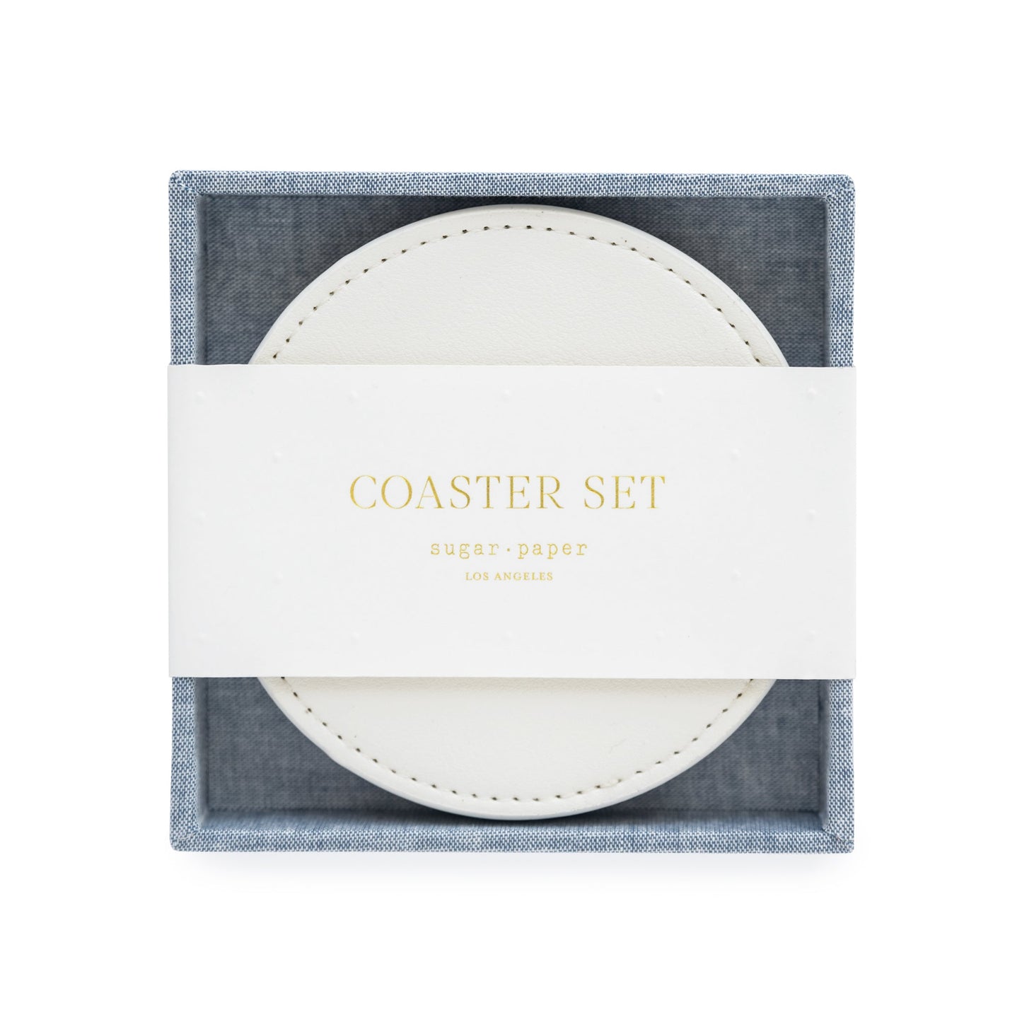 White coasters in chambray fabric holder