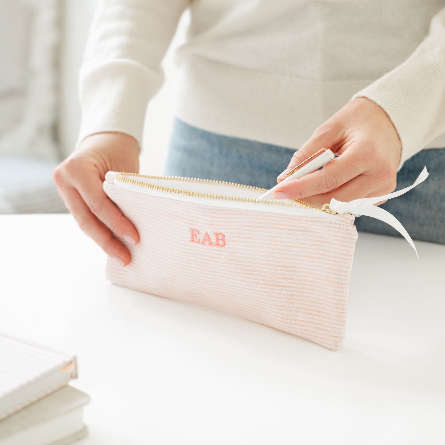 Pink stripe pencil pouch with 'EAB' initials in pink embroidery