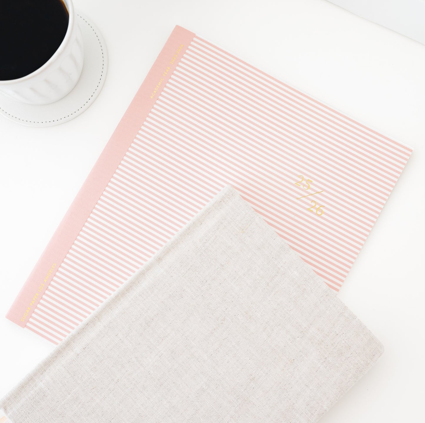 rose stripe 25-26 planner and flax tailored journal with cup of coffee