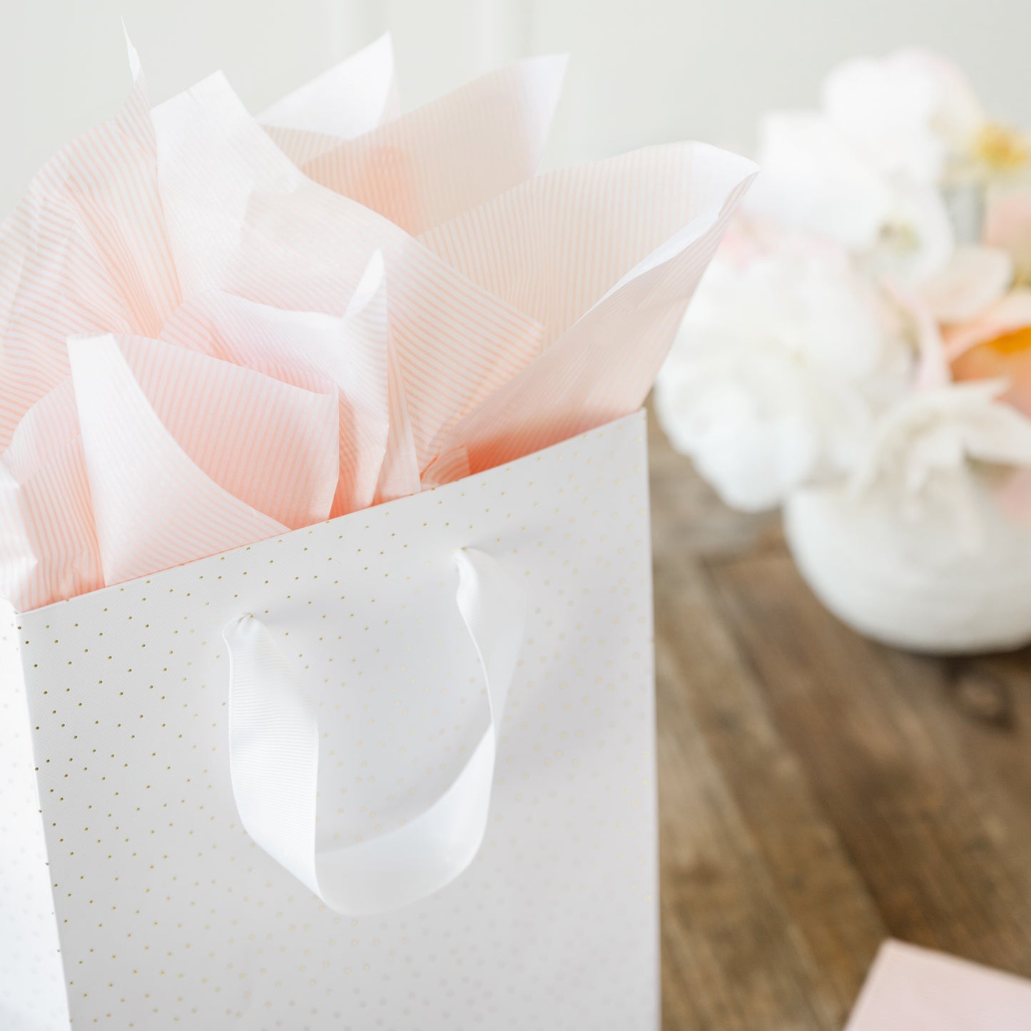 gold dot bag with rose stripe tissue paper