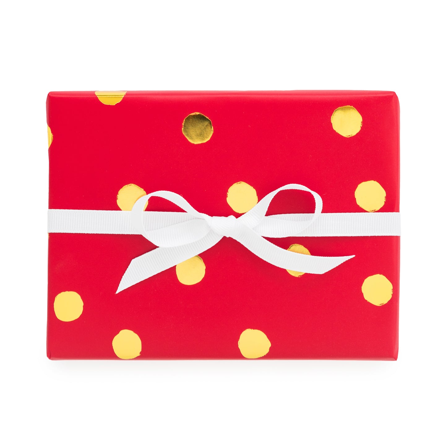 A roll of red wrapping paper with yellow polka dots and a white ribbon bow on top.