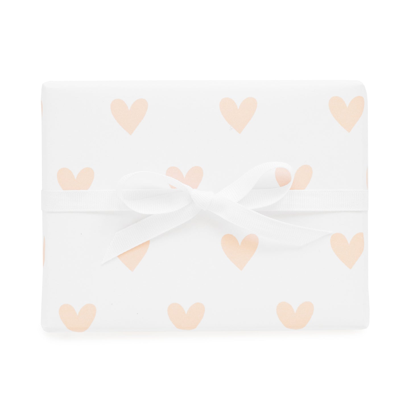 pink heart gift wrap shown tied with a white ribbon