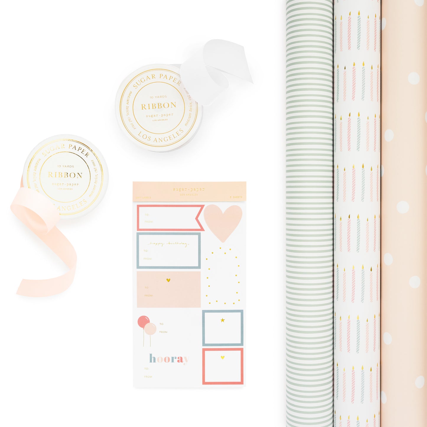 Gift wrap kit with 3 rolls of wrap in green stripe, birthday candle pattern and pink dot with ribbon and gift stickers