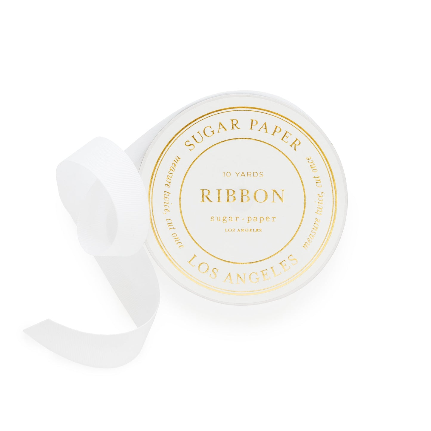 white ribbon spool with gold foil details