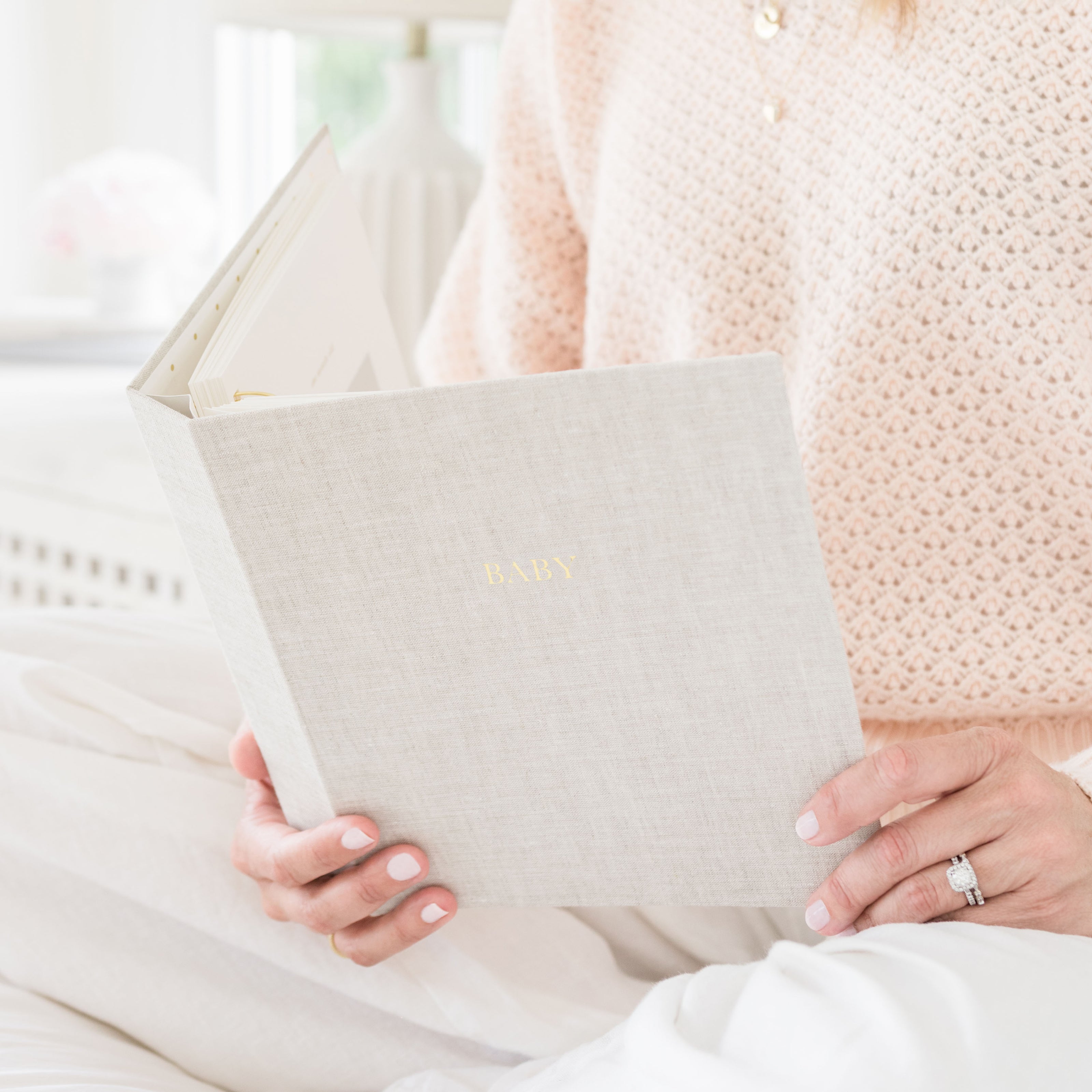 Flax baby book in hands