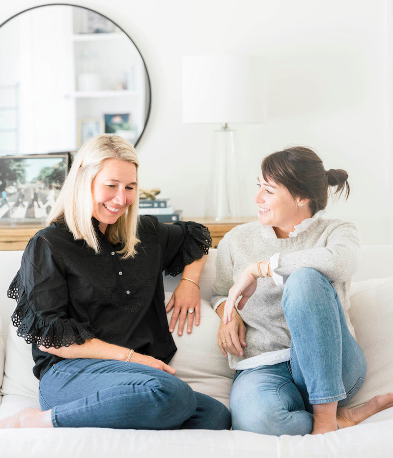 Sugar Paper founders, Jamie and Chelsea, on couch