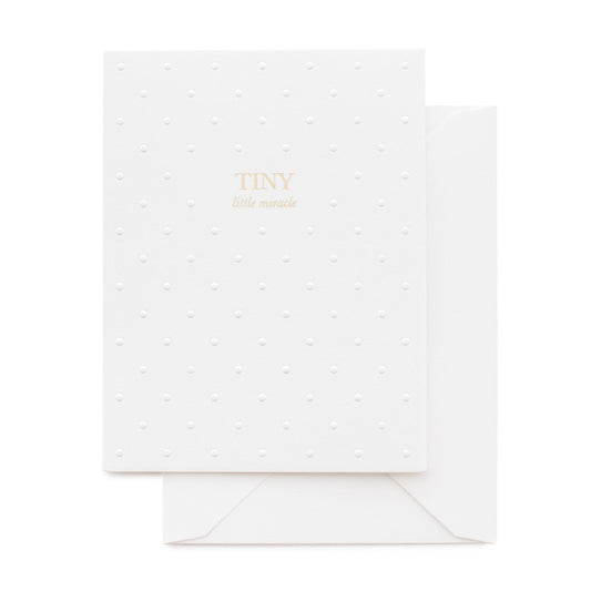 White with embossed dot baby card printed with Tiny Little Miracle in gold foil