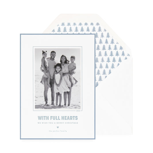white card with photo, slate blue text and border, white envelope with blue tree liner