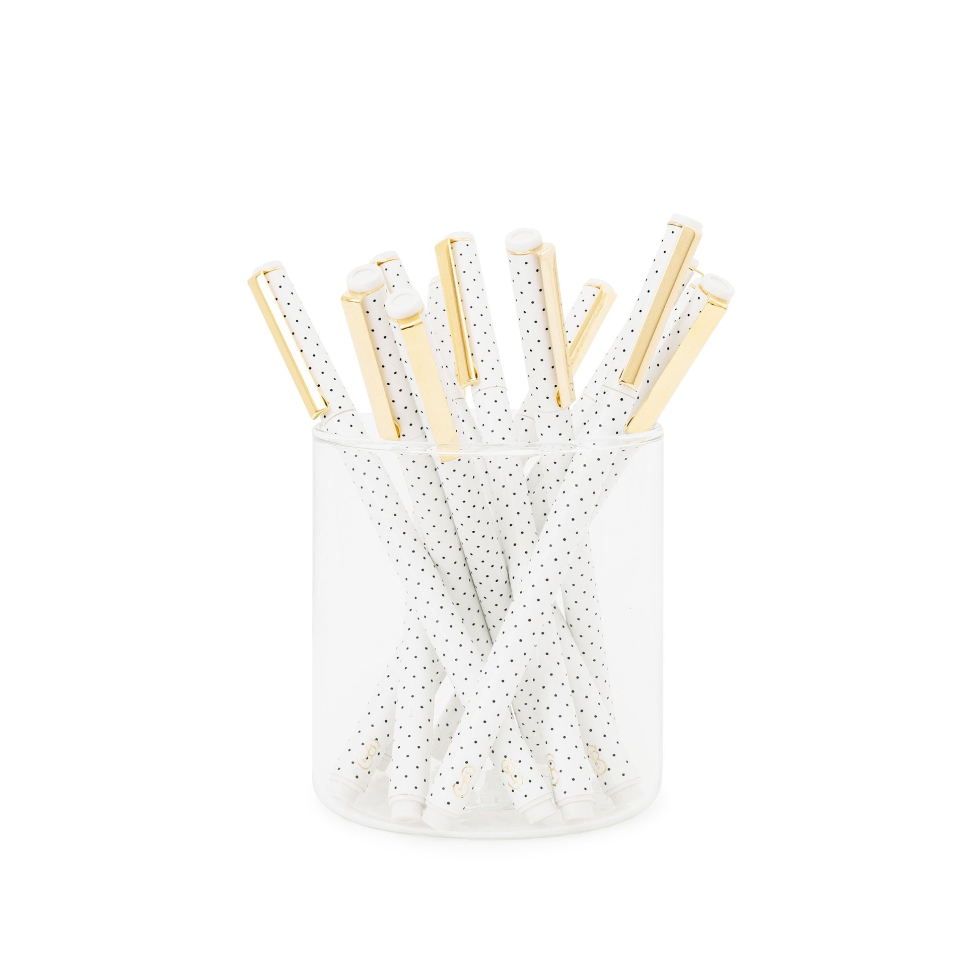 White with black dot felt pens in glass jar