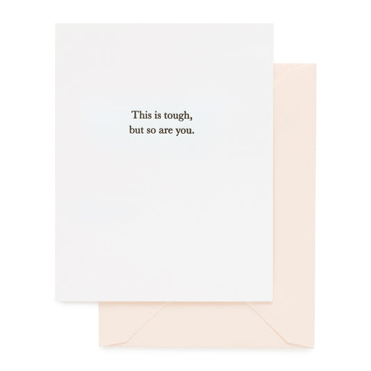 white card with black text, pale pink envelope