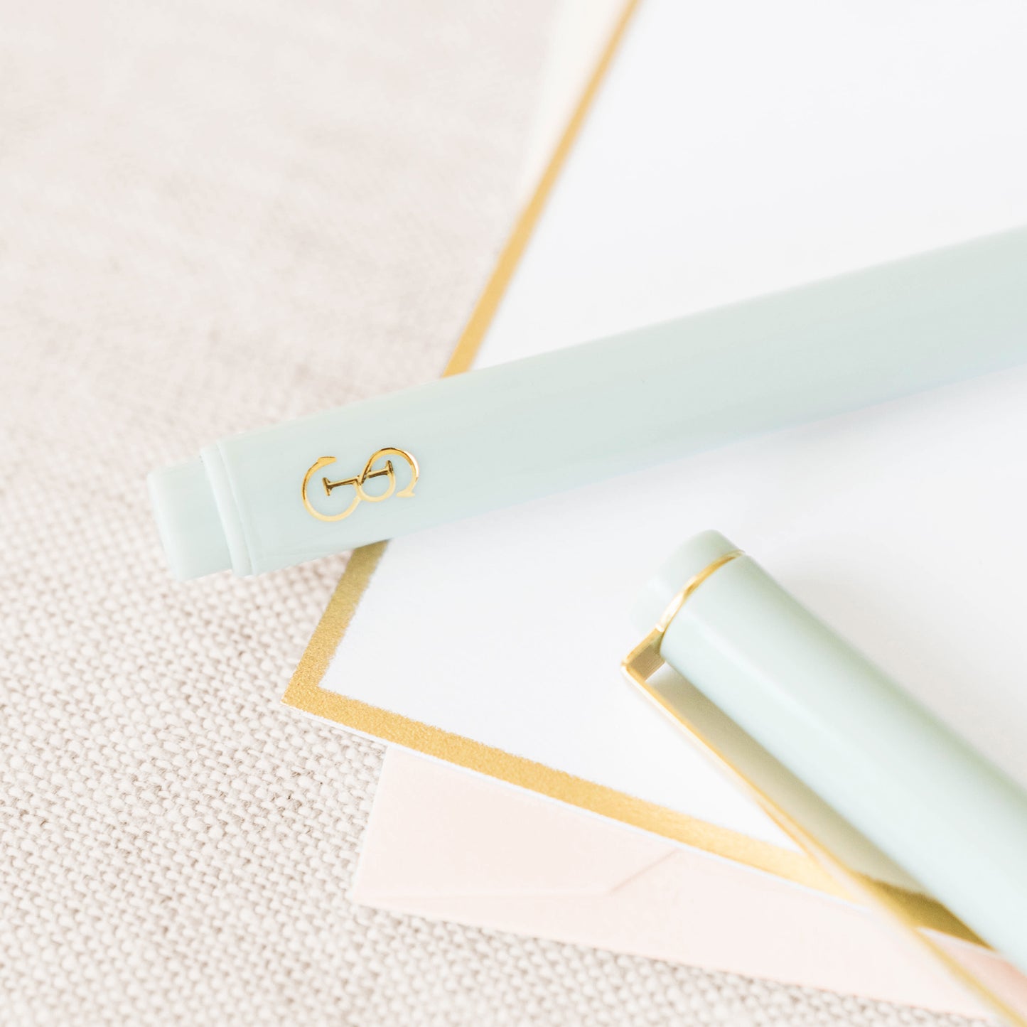 Gold logo on green felt pen