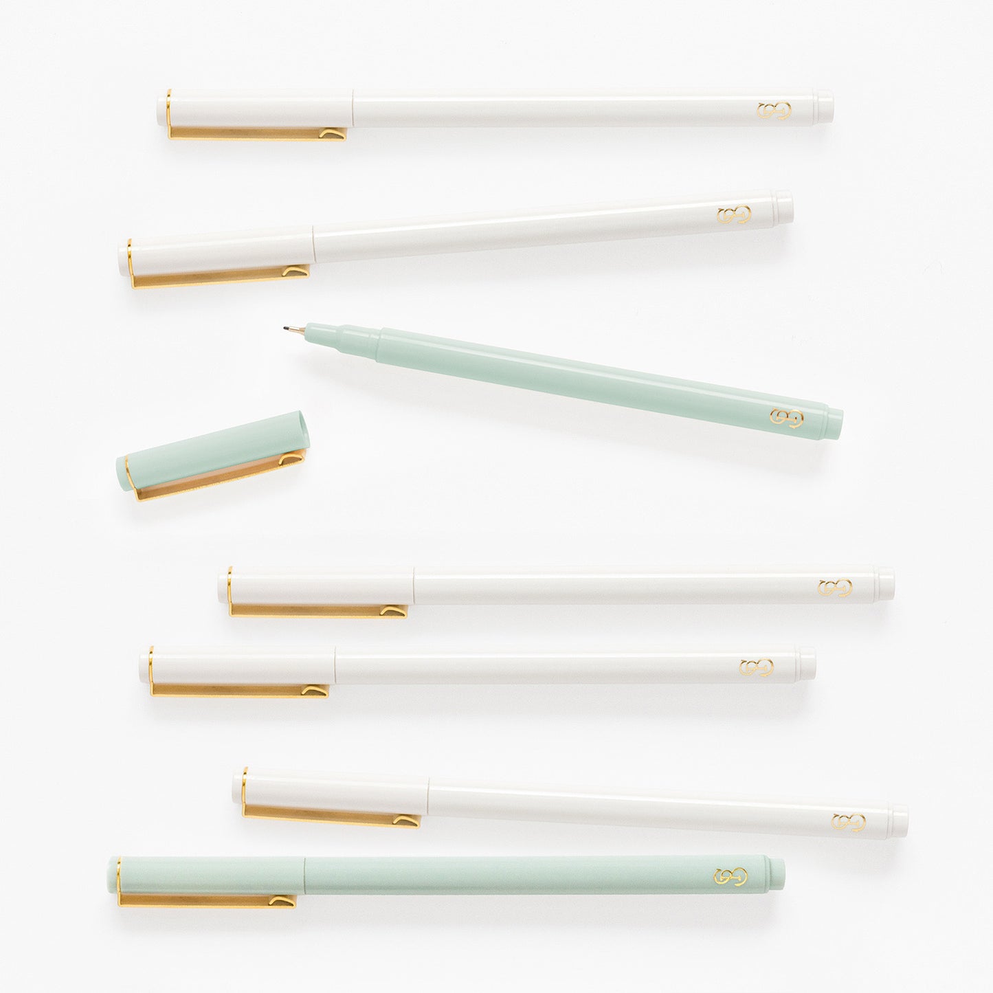 Mint green and white felt tip pens