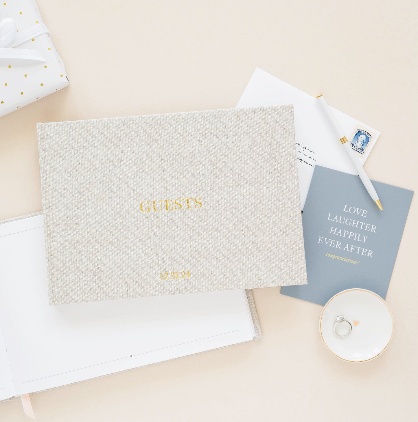 Wedding guest book with wedding card and ring dish