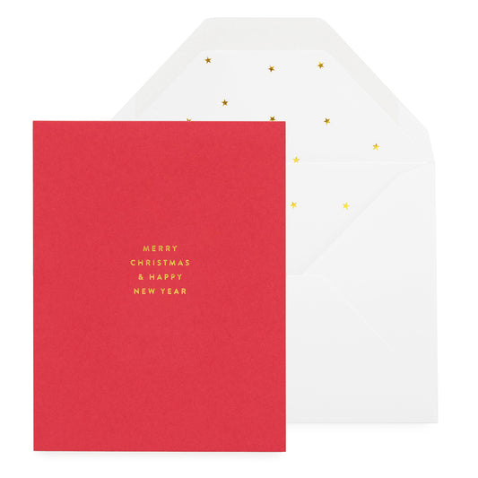 A red holiday greeting card with 'Merry Christmas & Happy New Year' printed in white, accompanied by a white envelope with gold star pattern liner