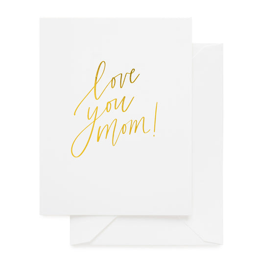 white card with gold text, white envelope
