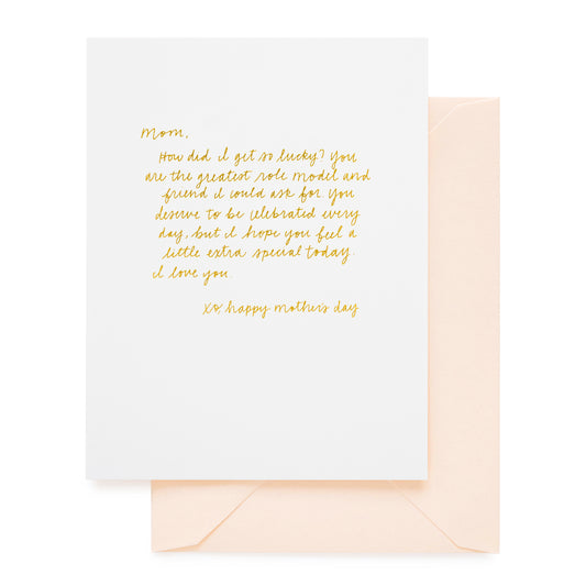 white card with gold text, pale pink envelope