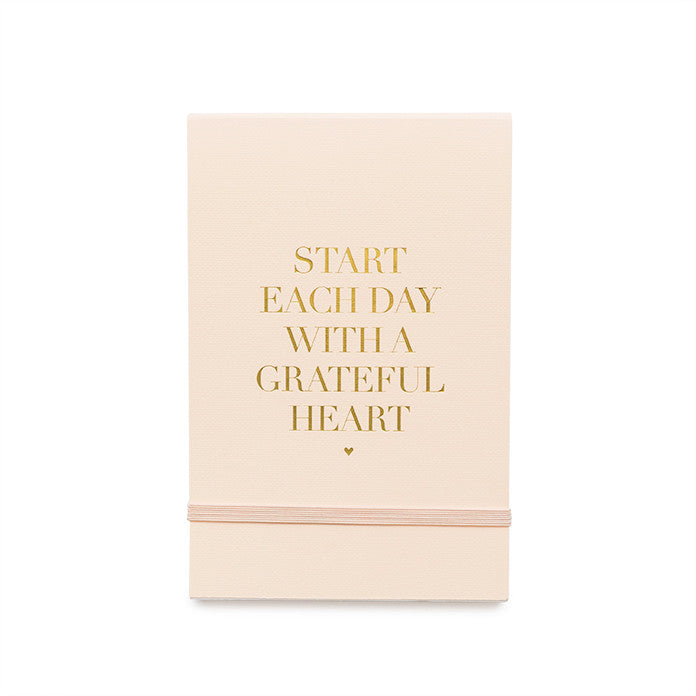 pale pink mini note pad with gold foil "Start Each Day With a Grateful Heart" and pink elastic band