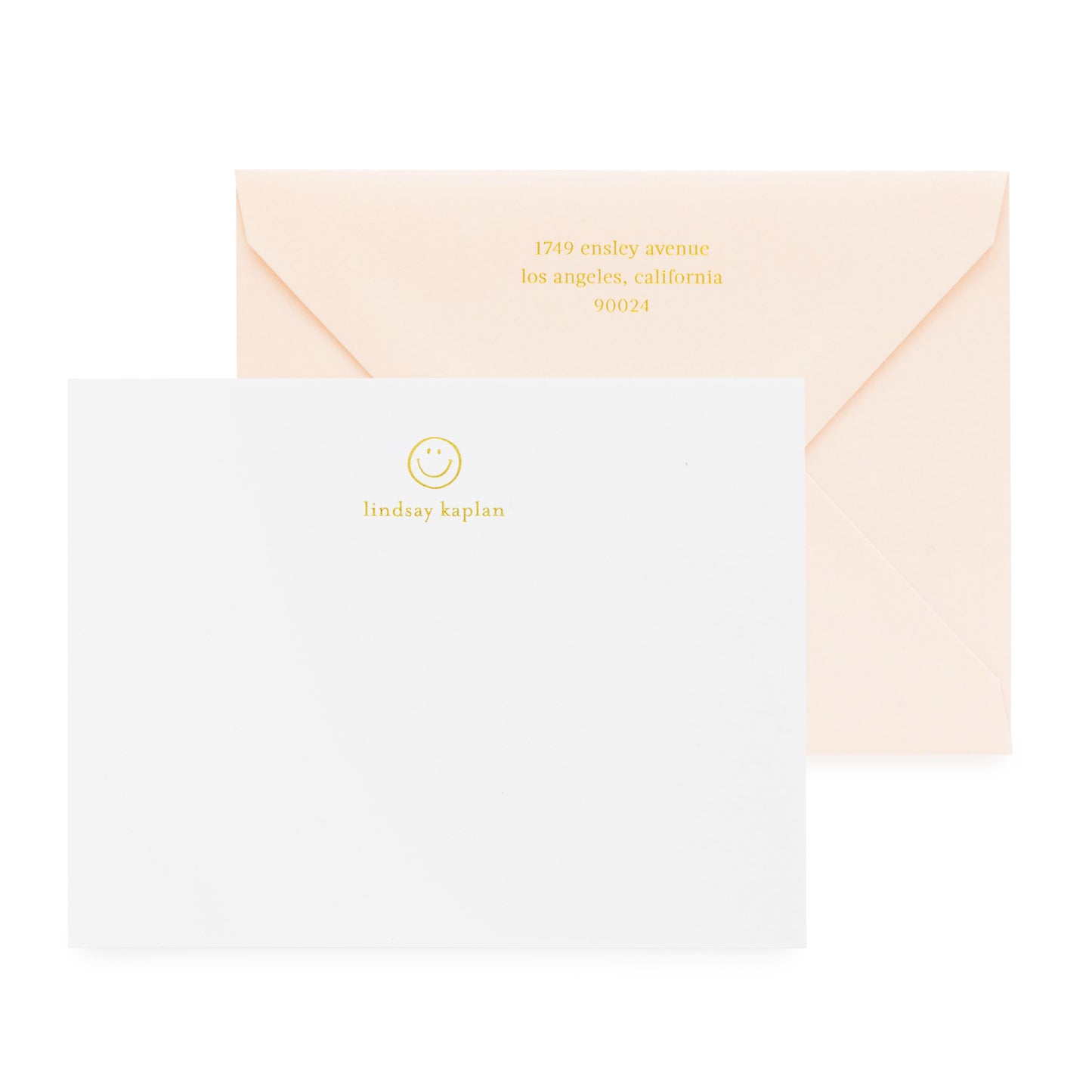 white card with gold foil smiley and text, pale pink envelope