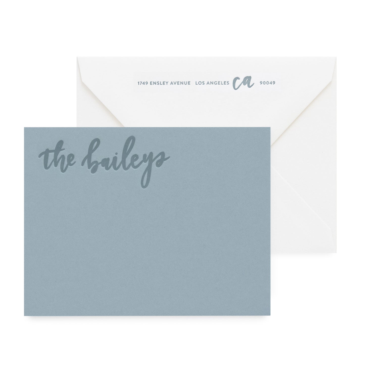 slate blue card with tonal text, white envelope