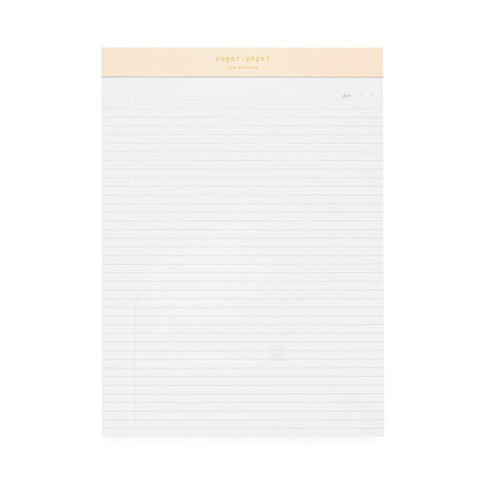 Legal pad with pink binding and gold foil logo