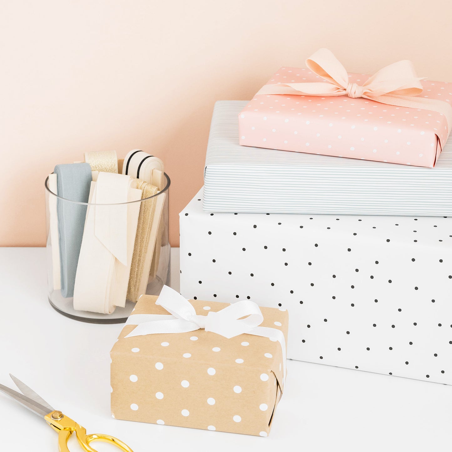 Stacked wrapped gifts with ribbon