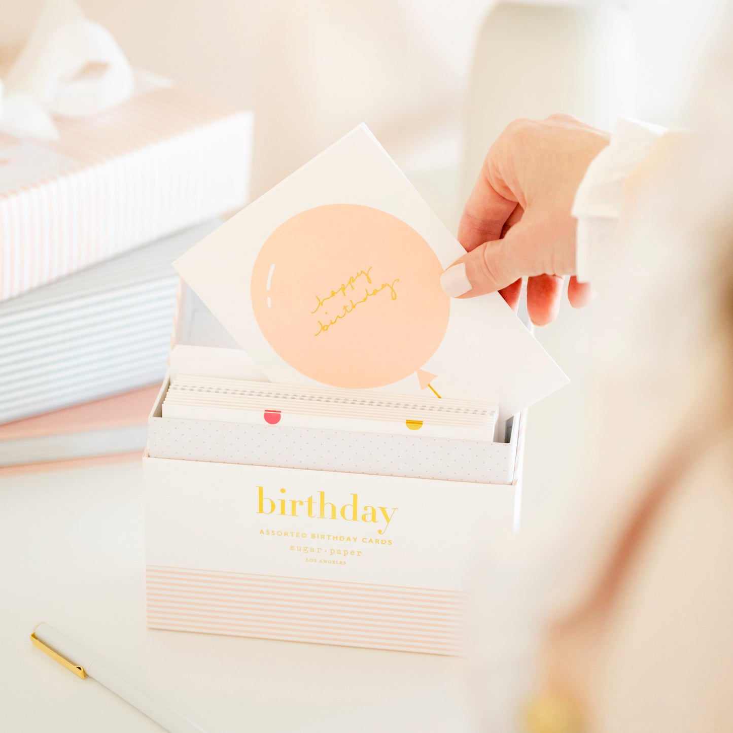 Birthday card being pulled out of birthday card box