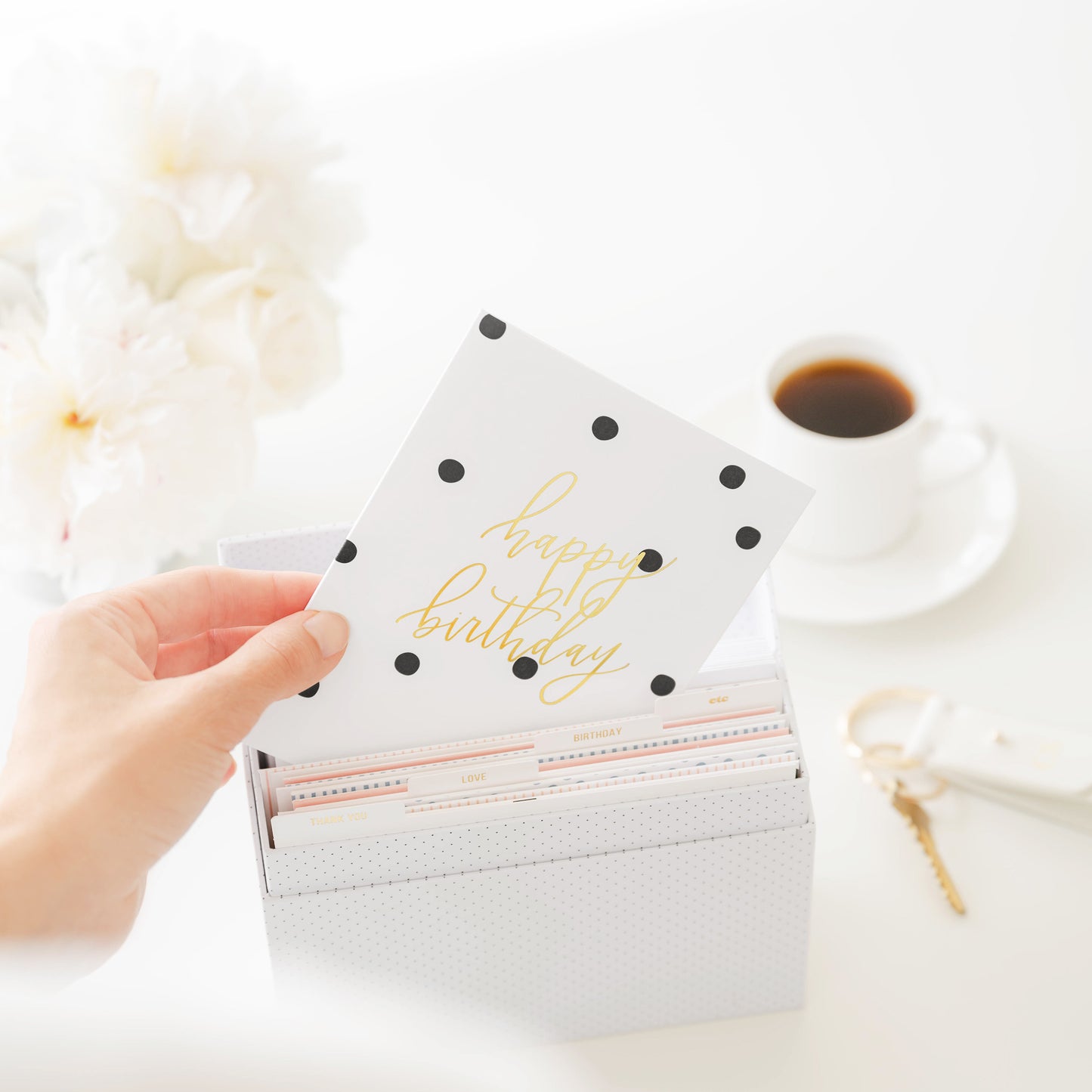 Woman pulling happy birthday card out of box