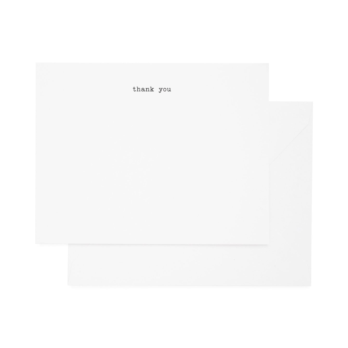 A simple thank you note card set with 'thank you' printed in a typewriter font, accompanied by envelopes.