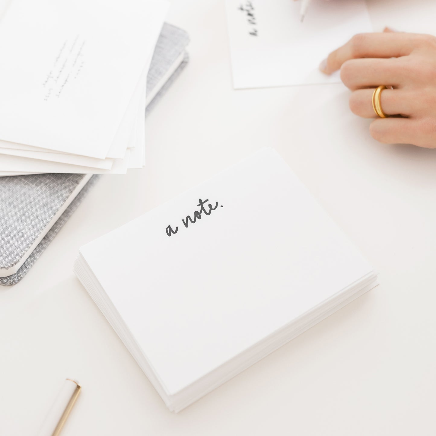 stack of white cards with black text on desk