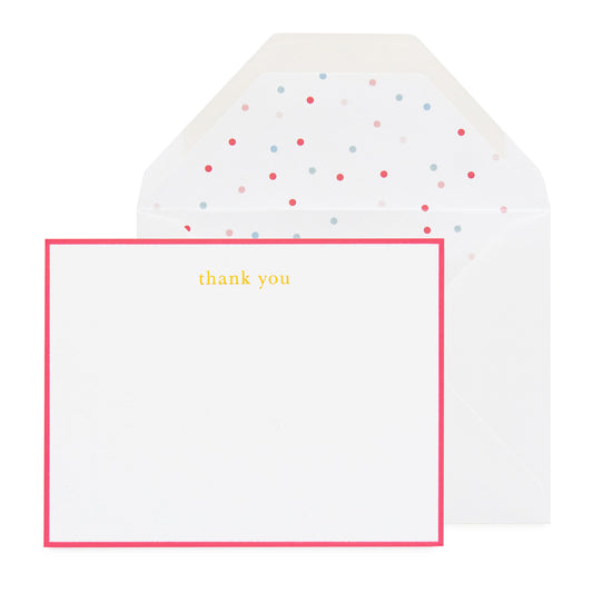 A thank you note card with a neon pink border and the words 'thank you' printed in the center, accompanied by a envelope with a multicolored dot pattern inside.