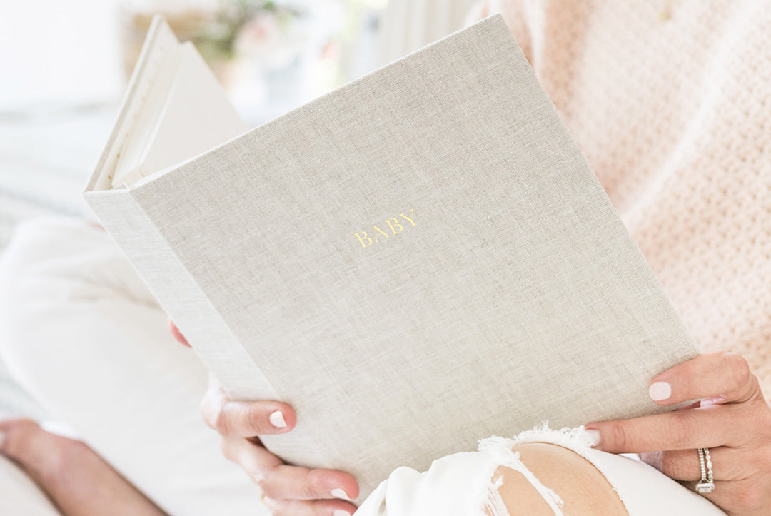 baby book flax in hands