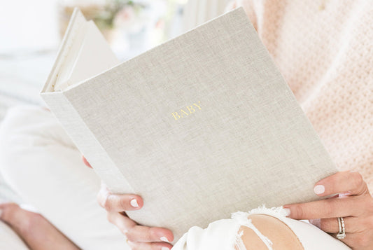 baby book flax in hands