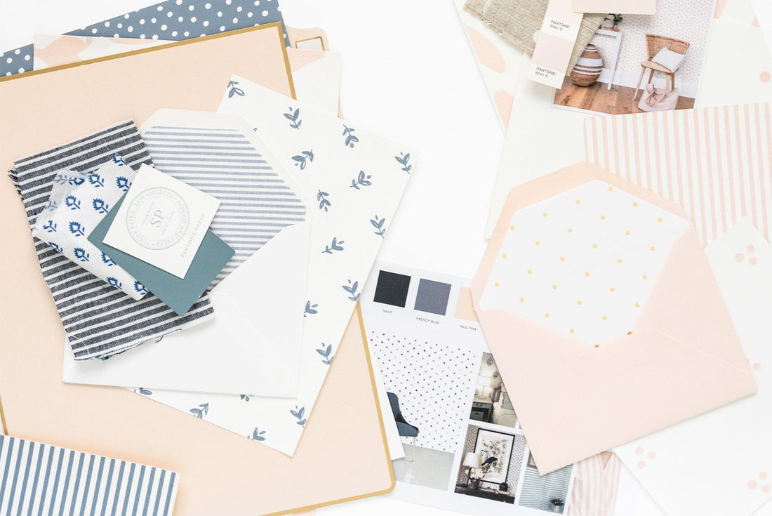 swatches of fabric, ink, paper, wallpaper in blue and pink colors