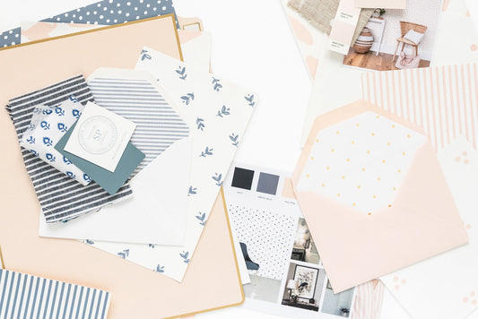 swatches of fabric, ink, paper, wallpaper in blue and pink colors