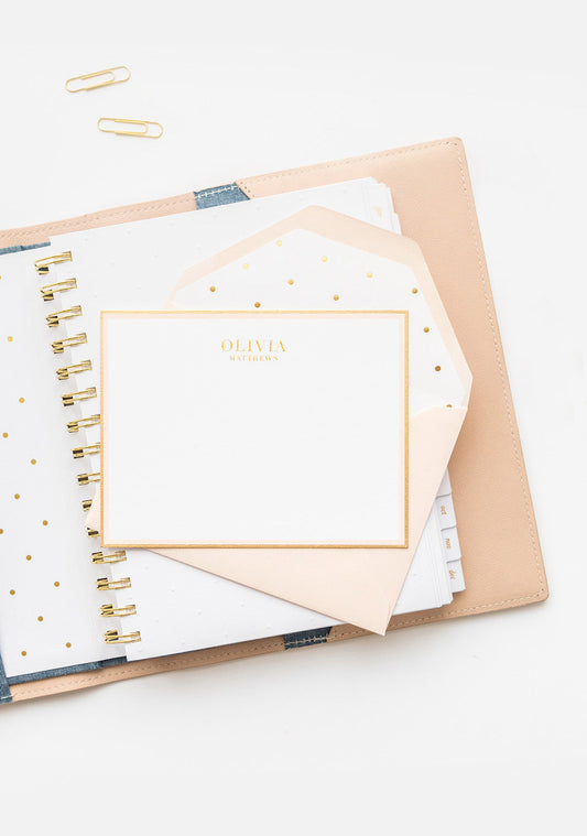 Pale pink custom stationery with hand painted gold border and pale pink envelope with gold dot liner