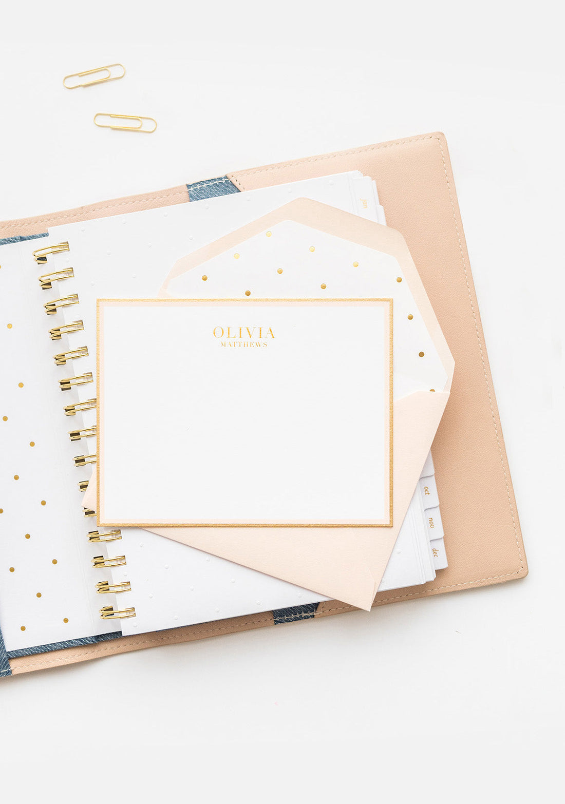Pale pink custom stationery with hand painted gold border and pale pink envelope with gold dot liner