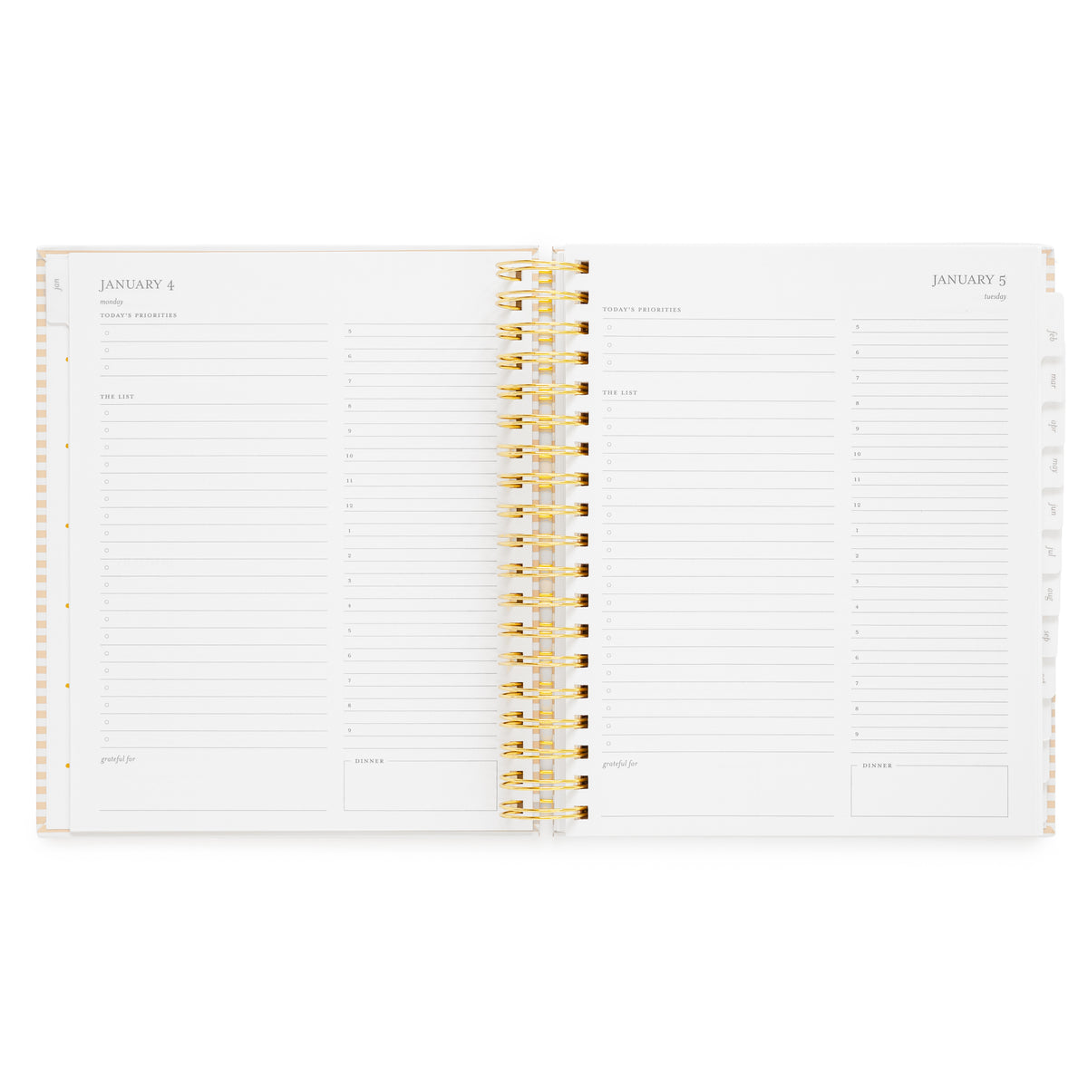 An open spiral-bound planner showing two white pages with grey text and daily planning pages with 'today's priorities,' 'the list,' 'grateful for'