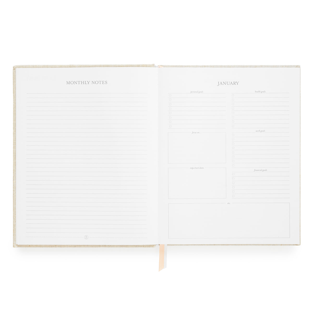 An open monthly planner with lined 'MONTHLY NOTES' pages on the left and a structured 'JANUARY' calendar layout on the right