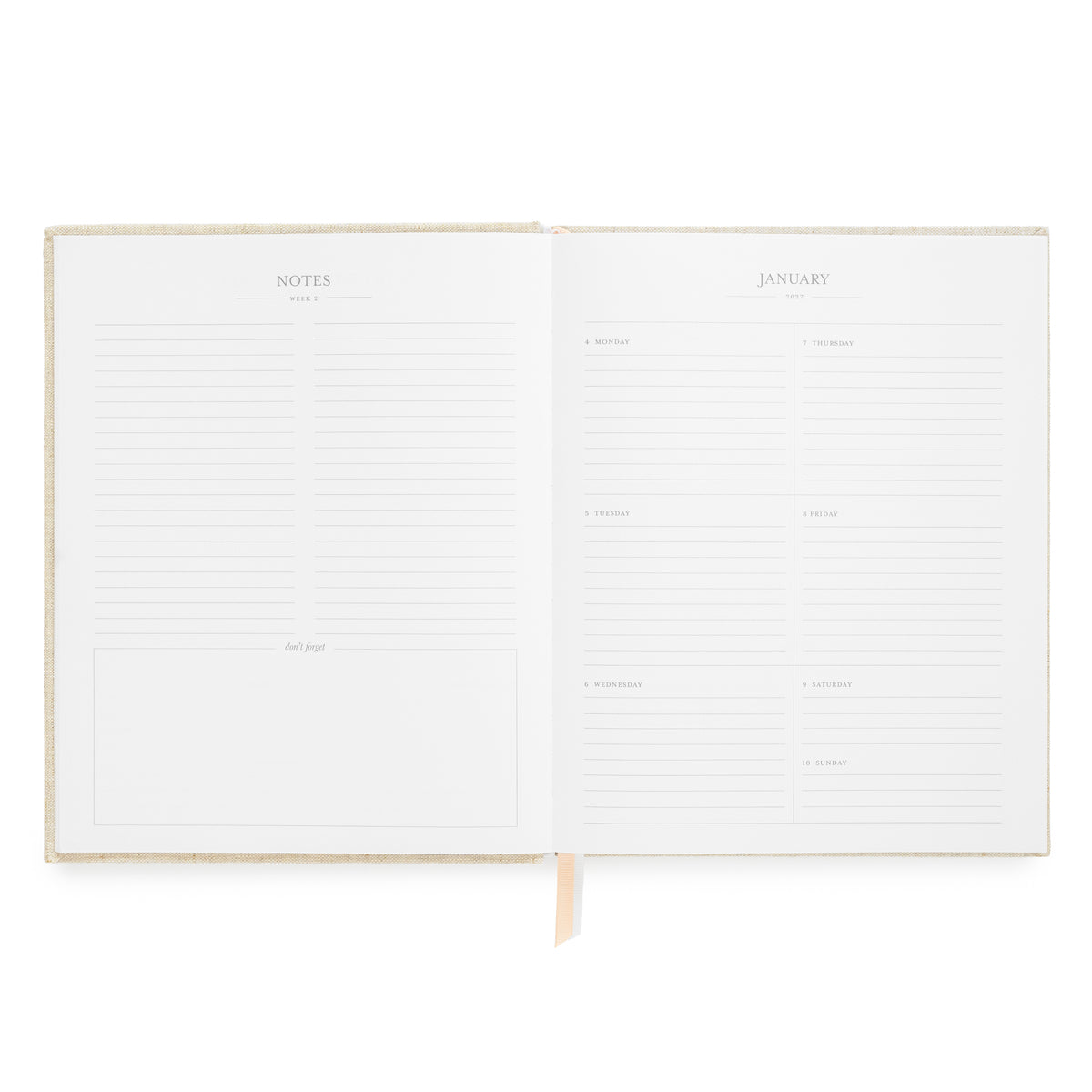 An open planner with lined pages, showing a notes page on the left and a January calendar page on the right