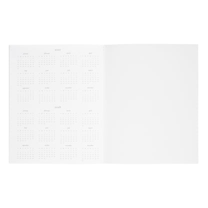 An open white planner with monthly grid showing the overview of 2027 and 2028 dates