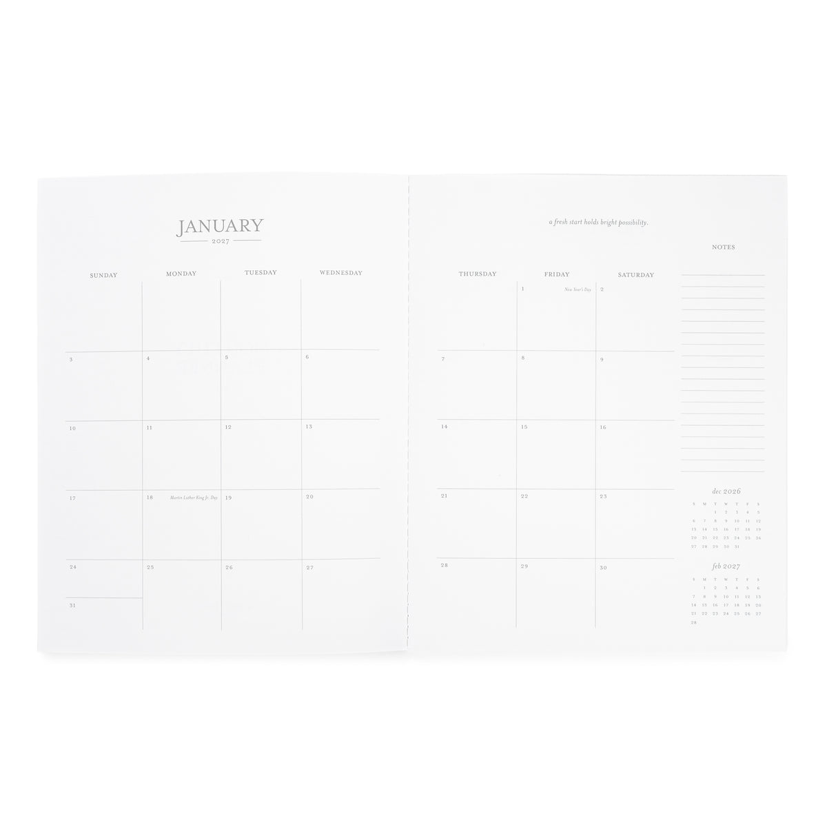 An open white planner or calendar spread showing the January 2027 monthly calendar page with daily boxes, weekly headers, an inspirational quote, and a notes section