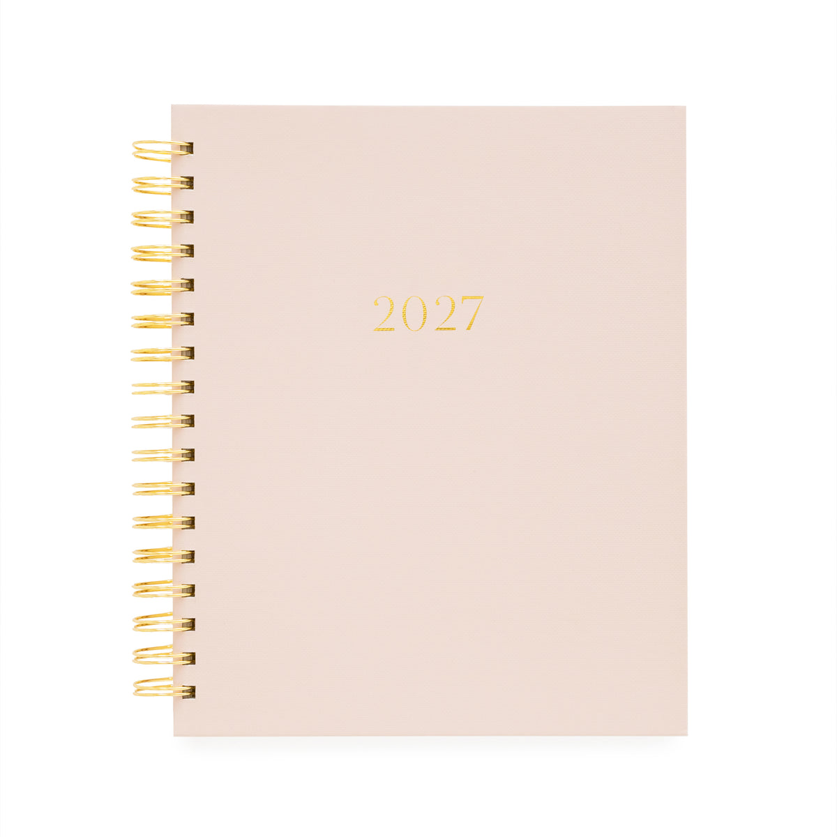A 2027 spiral-bound planner with a pale blush pink cover and gold foil lettering, bound with a gold wire coil