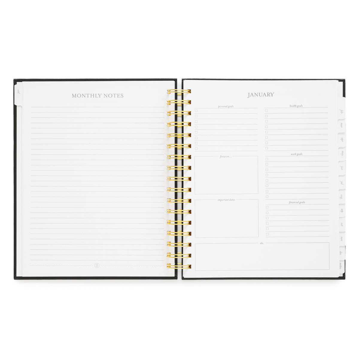 An open spiral-bound planner with white pages, showing a monthly notes page on the left and a January calendar layout on the right with goal setting prompts