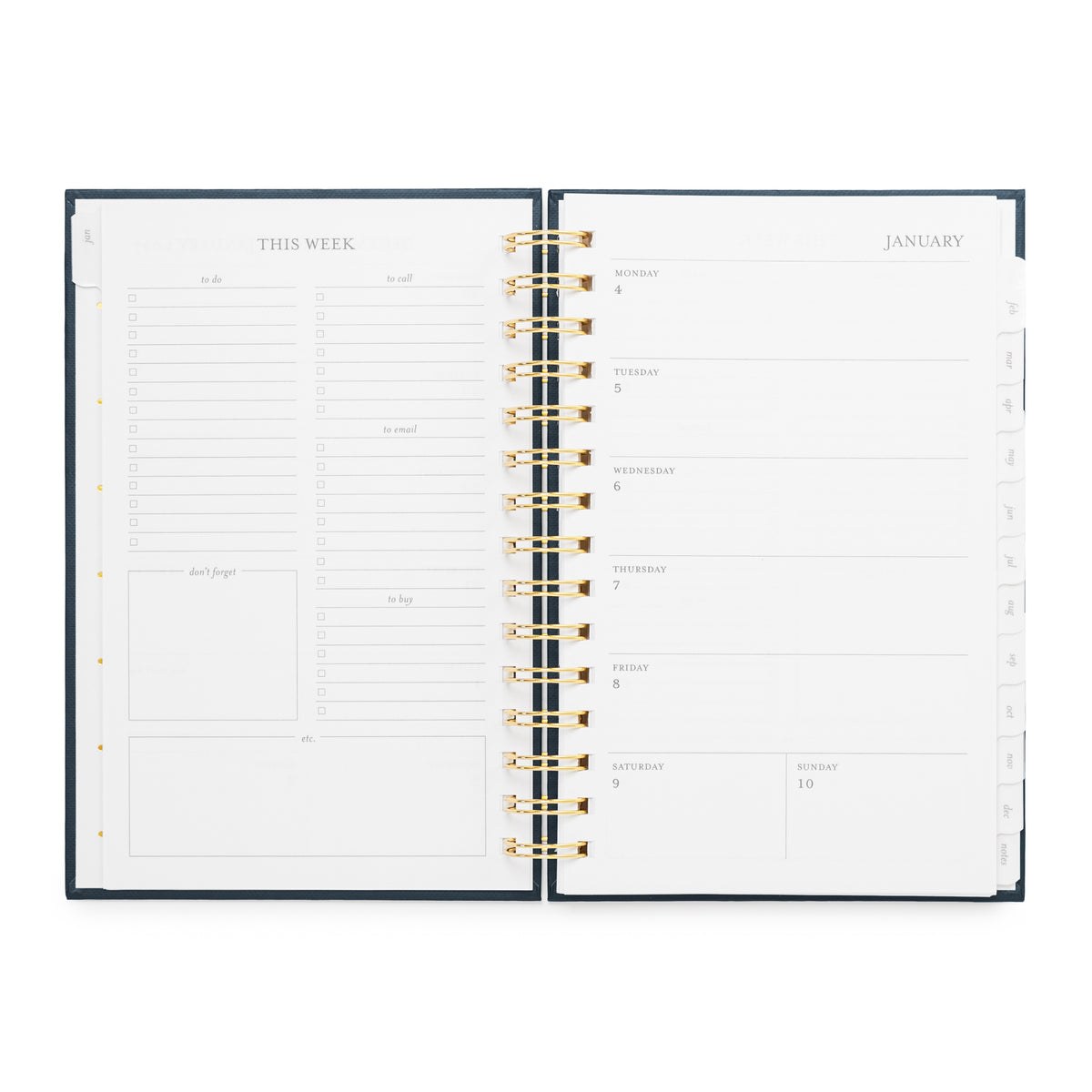 An open weekly spiral planner with interior pages visible, featuring a dark navy cover, gold spiral binding, and white pages with black text and lines. The left page shows weekly planning sections, and the right page shows a weekly January calendar layout with daily boxes.