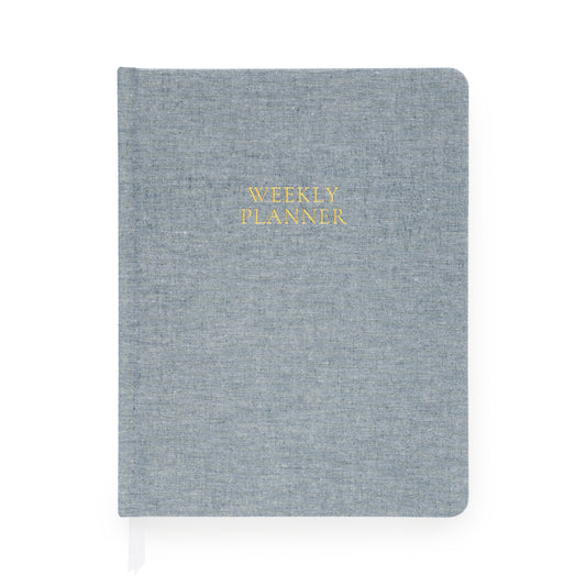 Chambray blue weekly planner foil stamped with weekly planner in gold on cover