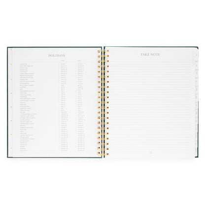 Open large weekly spiral-bound planner with 2026 + 2027 Holidays and 'Take Note' lined note page