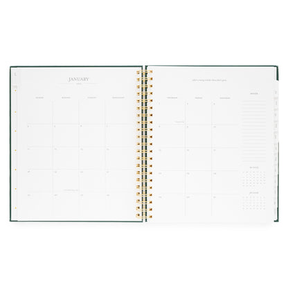 Open large weekly spiral-bound planner showing a monthly layout with January 2026