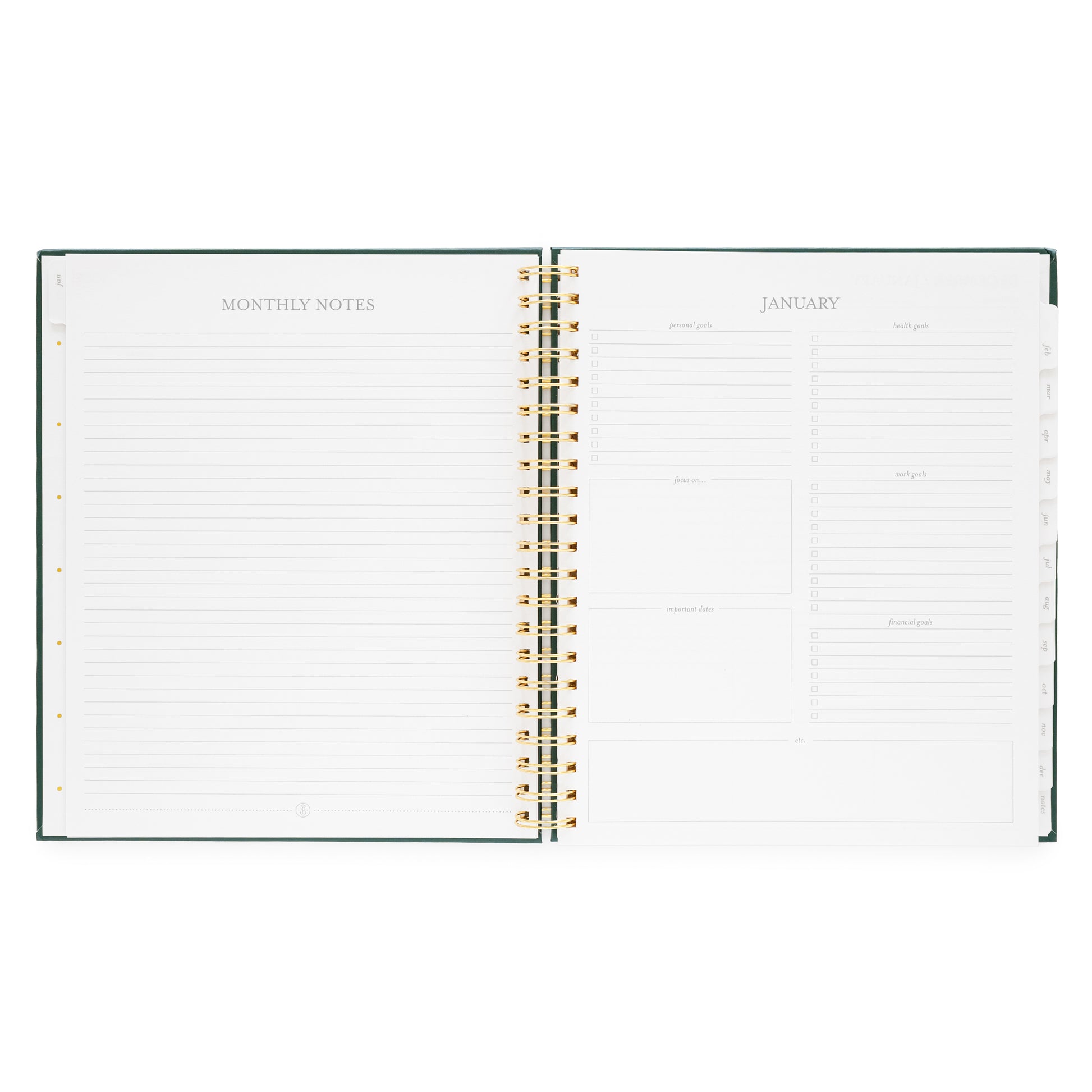 Open large weekly spiral-bound planner showing monthly notes and goals for January 2026
