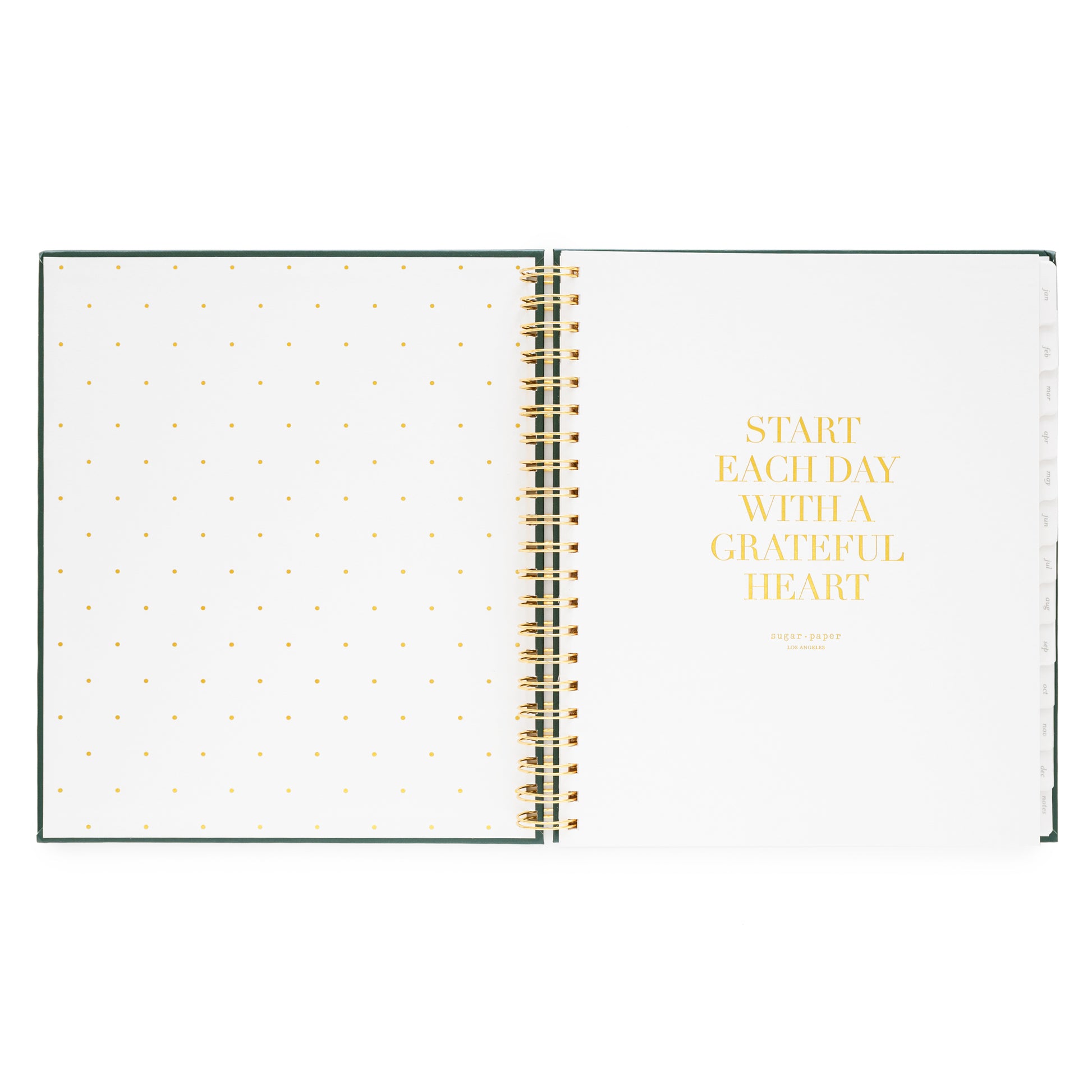 Open spiral-bound planner with polka dot pages foil printed with "start each day with a grateful heart"