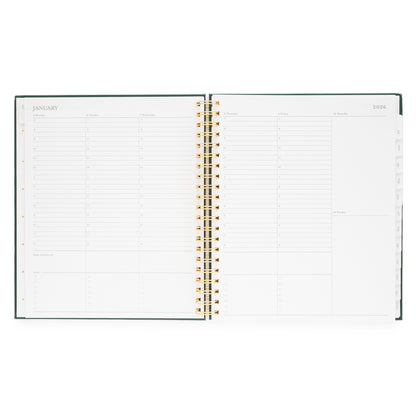Open large weekly spiral planner showing a weekly layout for January 2026 with timed slots for each weekday and room for weekend dates
